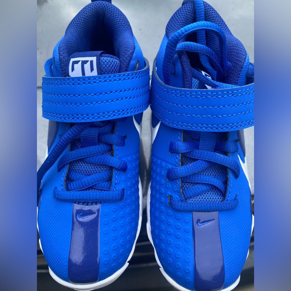 Brand new blue baseball kid cleats